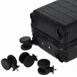 A black suitcase with four removable wheels placed beside it. The suitcase has a textured surface and visible connectors.