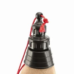 A drink bottle with a black top and a red pull cord. It has a textured surface.