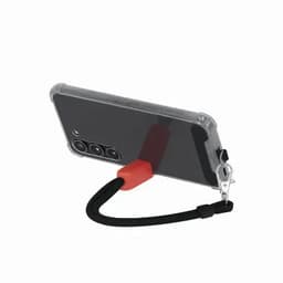 A phone case with a black strap and a red attachment point, featuring a clear back and camera cutouts.