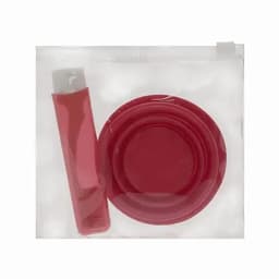 A drink bottle and a matching dish set in a transparent pouch, both in a vibrant red colour.