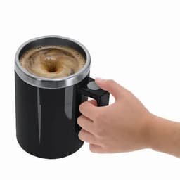 A drink bottle in black with a stainless steel rim, featuring a handle, containing coffee with froth on top.