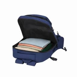 A navy blue backpack opened to reveal neatly stacked clothing inside. It features a logo.