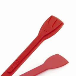 A red plastic tool with a flat edge, featuring a logo on one side, ideal for lifting or prying.