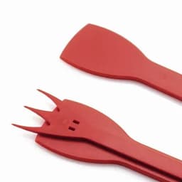 A set of red kitchen utensils, including a spatula and a fork-like tool, with a smooth surface and a functional design.