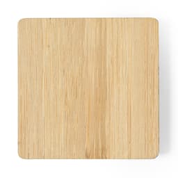 A square bamboo coaster with a smooth, natural wood finish, featuring rounded corners.