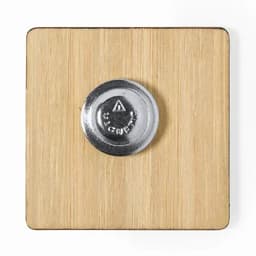 A square bamboo coaster with a metallic base. The coaster features a round silver button in the centre.