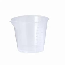 A transparent measuring cup with measurement markings on the side and a spout for pouring.