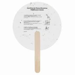 A round seed packet for wildflower seeds with a wooden stick. The packet features a speckled design.