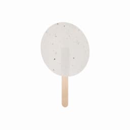 A round, speckled ice cream pop with a wooden stick, featuring a creamy white colour.