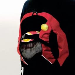 A red and black mesh backpack featuring a round yellow fastening, designed for carrying various items.