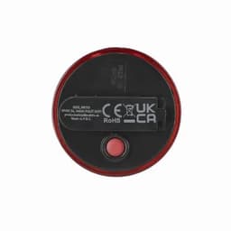 A round security light in red and black with a button and a small logo.
