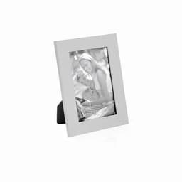 A photo frame with a sleek white border, displaying a black and white image of a couple.