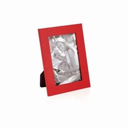 A red photo frame displaying a black and white image of a couple. The frame is upright and has a stand at the back.