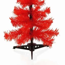 A small artificial Christmas tree with vibrant red branches, set in a black stand.