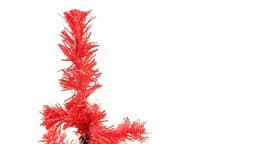 A decorative red artificial tree with spiky branches, featuring a compact design and vibrant colour.