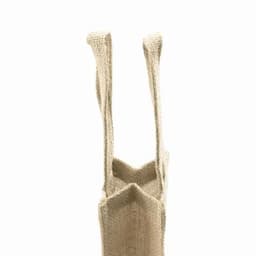 A jute tote bag in natural beige with long handles and a structured shape.