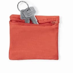A small orange pouch with a zipper containing a set of keys.