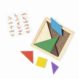 A tangram puzzle set featuring colourful geometric shapes in a wooden box, alongside a sheet with design ideas.