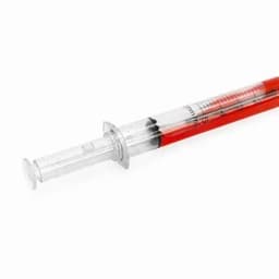 A syringe filled with red liquid, featuring measurement markings and a plastic plunger.