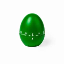 A green egg-shaped timer with a white scale and arrow indicator, resting on a plain background.