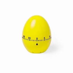 A yellow egg-shaped timer with a black scale displaying minute markings from 0 to 60.