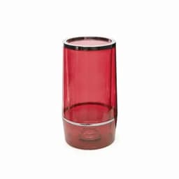 A drink bottle in glossy red plastic with a silver rim. It has a sleek, modern design and a transparent body.