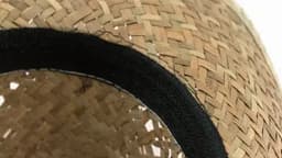 A woven straw hat with a black band around the rim. The interior shows the intricate weaving pattern.