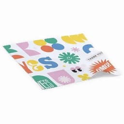 A cleaning cloth featuring a colourful design with various shapes and patterns. It includes a logo in one corner.