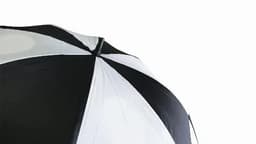 A black and white golf umbrella with a curved top and a logo visible on the fabric.