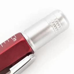 A red and silver pen with a clear cap, featuring measurement markings on the barrel. It has a metallic clip.