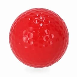 A red golf ball with a dimpled surface. The ball has a glossy finish and is spherical in shape.