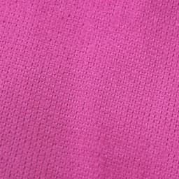 A textured pink gym towel featuring a woven pattern and a branding logo.