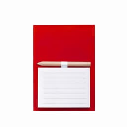 A red notebook with horizontal lines and a wooden pencil placed on top. The notebook has a simple design.