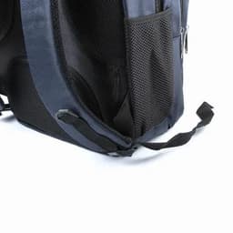 A dark blue backpack with a textured black mesh side pocket and adjustable straps. It features a zippered compartment.