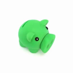 A green piggy bank with plastic eyes and a rounded body designed for saving coins.