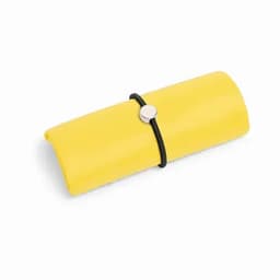 A yellow rolled-up product secured with a black elastic band, featuring a silver accent.