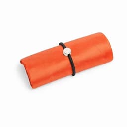 An orange, rolled-up product secured with a black band, featuring a circular metallic closure.