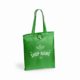 A green reusable shopping bag with a handle and a circular detail, featuring a logo and decorative leaves.