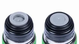 A drink bottle featuring a grey and black cap. It has a sleek design and includes a logo.