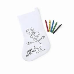 A Christmas stocking featuring a cartoon reindeer design, accompanied by four crayons in various colours.