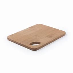A wooden cutting board in a rectangular shape with a rounded handle on one side.