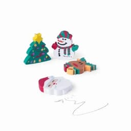 Colourful Christmas-themed erasers, including a tree, snowman, reindeer, and Santa, arranged on a white background.