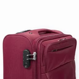 A maroon suitcase with a sturdy zipper and combination lock, featuring a side pocket for extra storage.