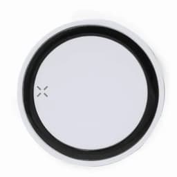 A round drink bottle lid in silver and black, featuring a smooth, flat surface with a central logo.