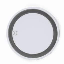 A round, flat product with a white outer edge and a dark grey inner circle, featuring a subtle logo in the corner.