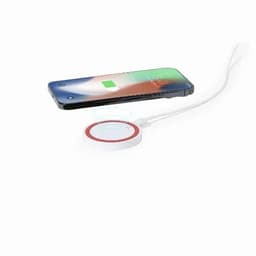 A wireless charger with a circular base in white, next to a smartphone displaying a charging icon.