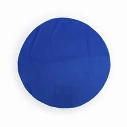 A round blue cloth with a fringed edge, displaying a smooth and flat surface.