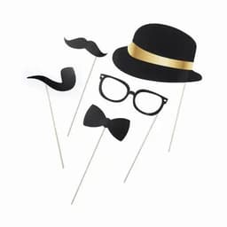 A set of black party photo props including a hat, glasses, moustache, and bow tie on sticks.