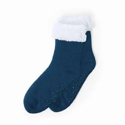 A pair of teal socks with a white fluffy cuff and non-slip dotted soles.