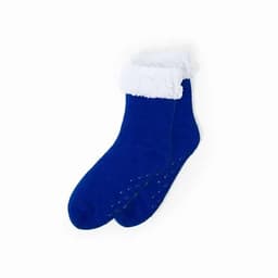 A pair of blue socks with a fluffy white cuff and dots on the sole for grip.